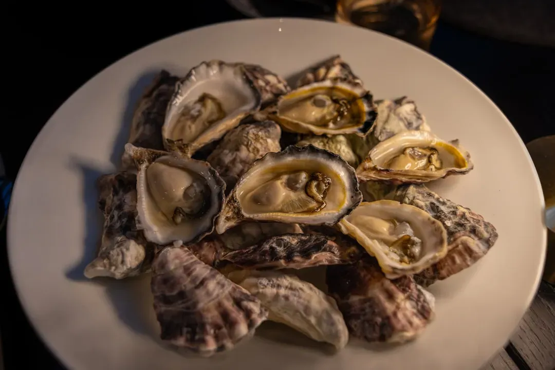 1. Raw Oysters and Shellfish (Image Credits: Unsplash)