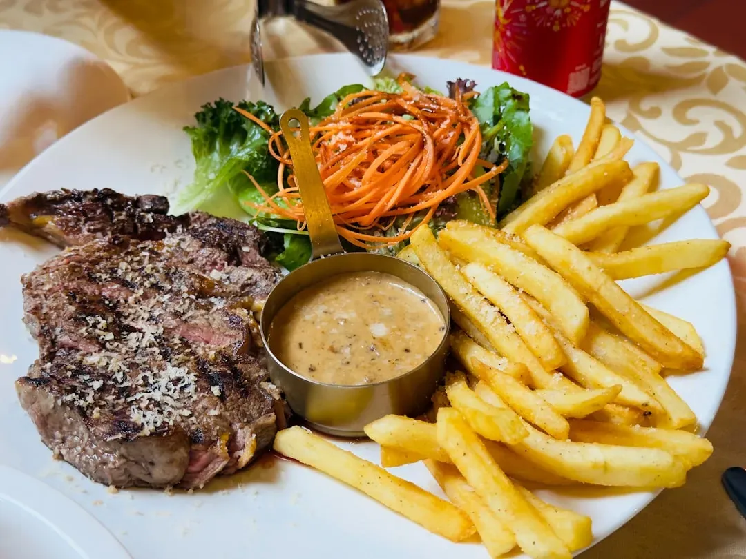 Aries: Grilled Steak with Sweet Potato and Greens (Image Credits: Unsplash)