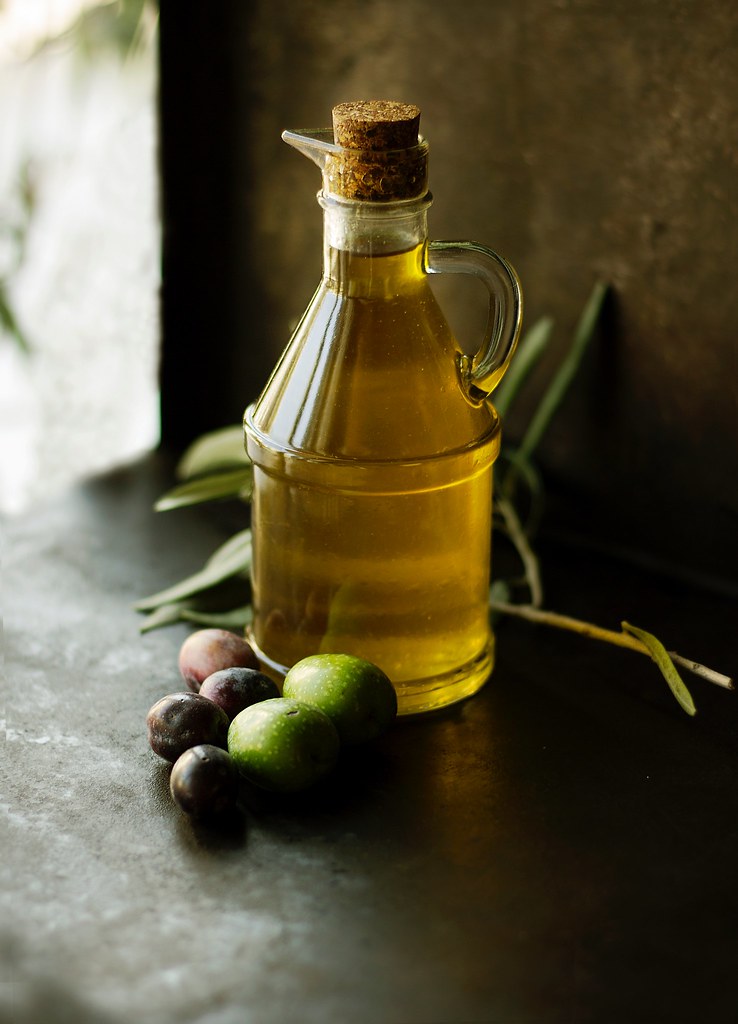 Bottled Oils with Herbs and Garlic (image credits: flickr)