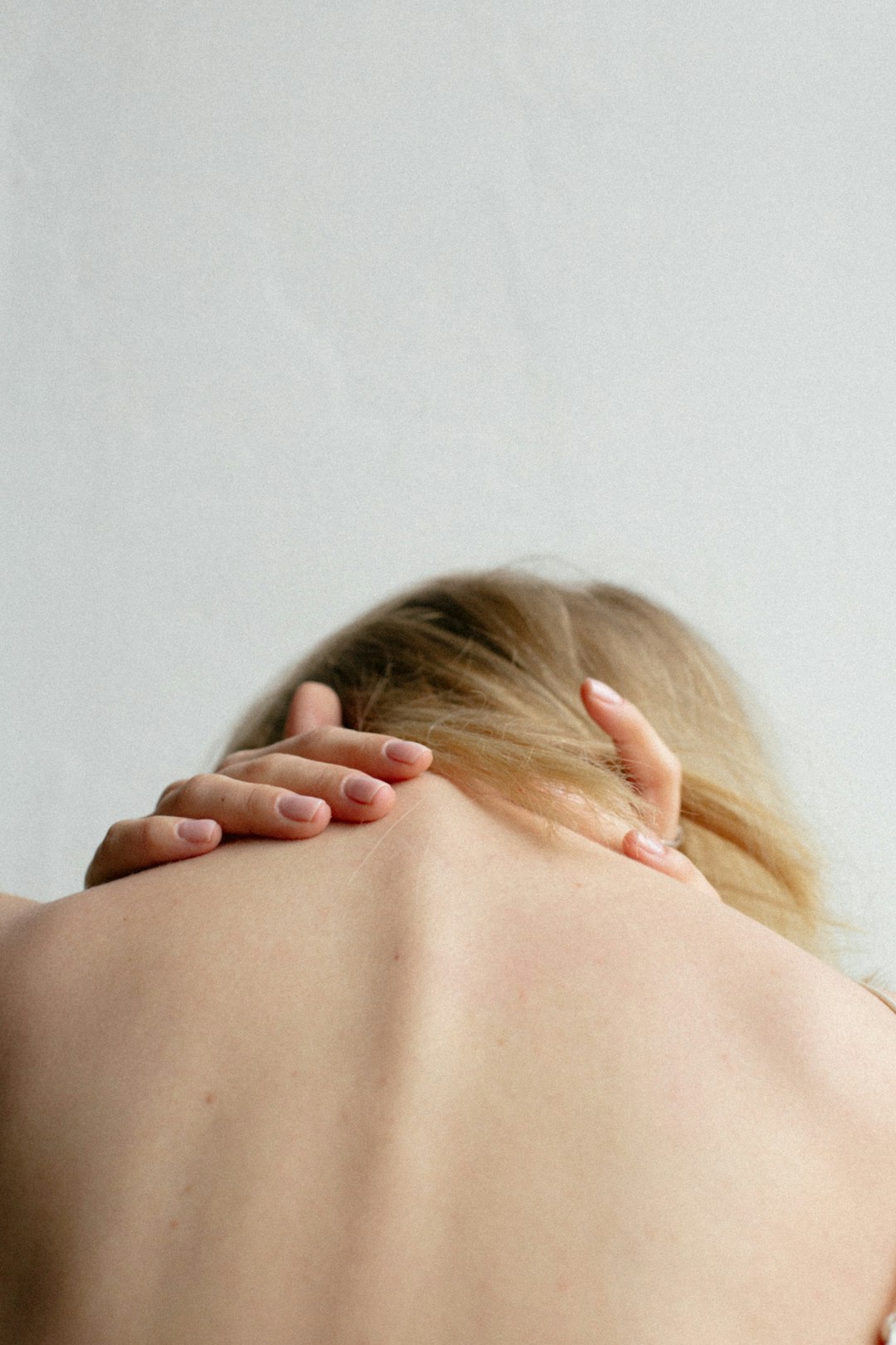 Behind-the-Head Shoulder Stretch (Lat Stretch) (image credits: unsplash)