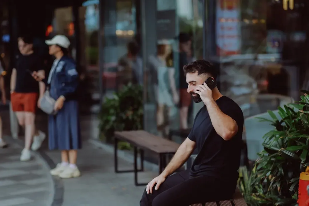 5. Having a Full Phone Conversation While Checking Out (Image Credits: Unsplash)