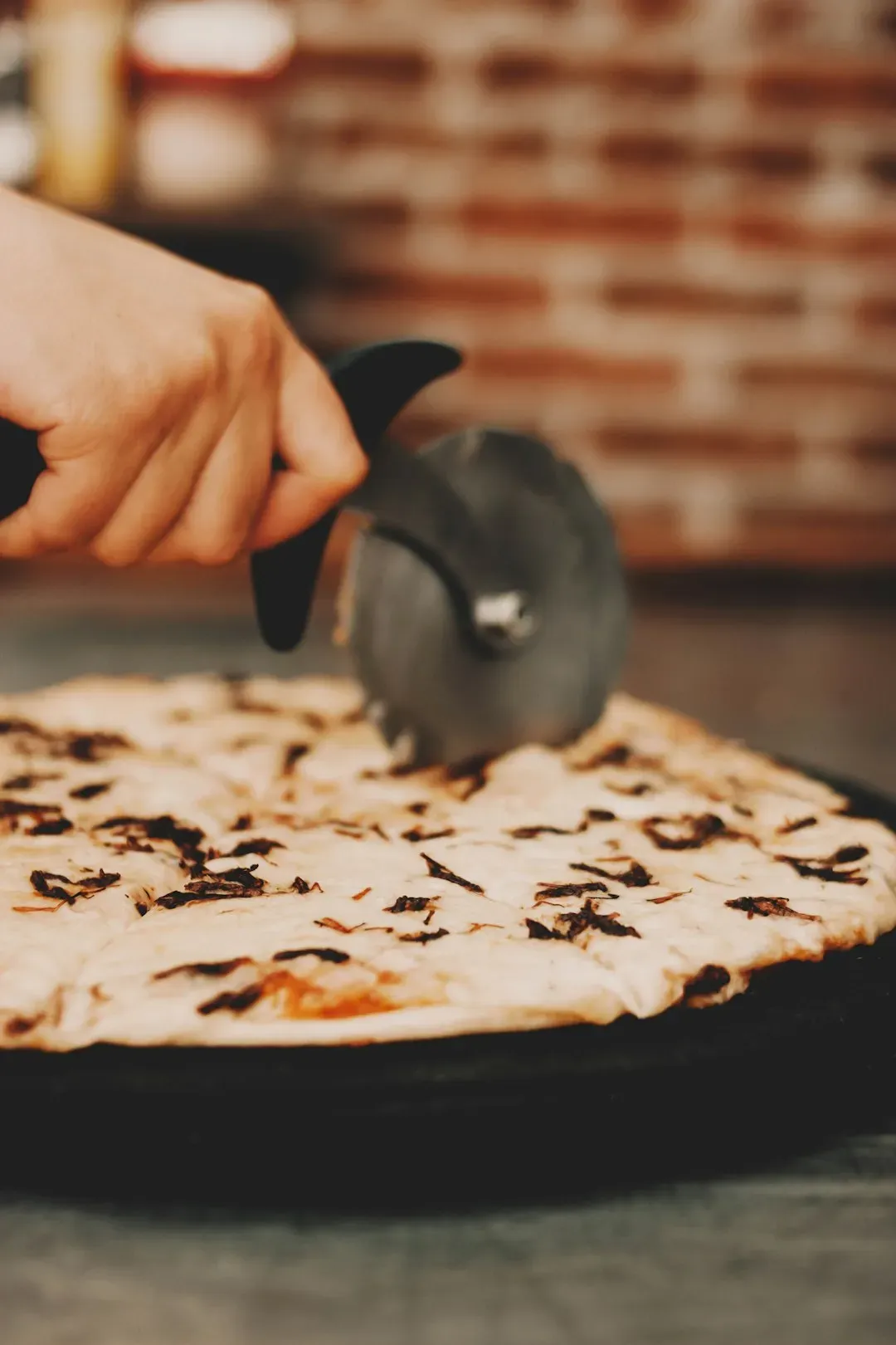 Pizza Cutters Destroy Your Pan's Surface (Image Credits: Unsplash)
