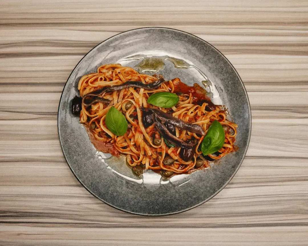 Spaghetti alla Puttanesca: Naples' Most Colorfully Named Dish (Image Credits: Unsplash)