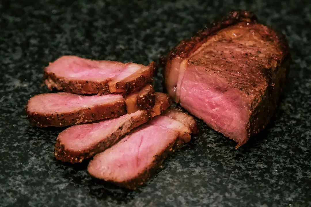 1. Raw or Undercooked Wild Game Meat (Image Credits: Unsplash)