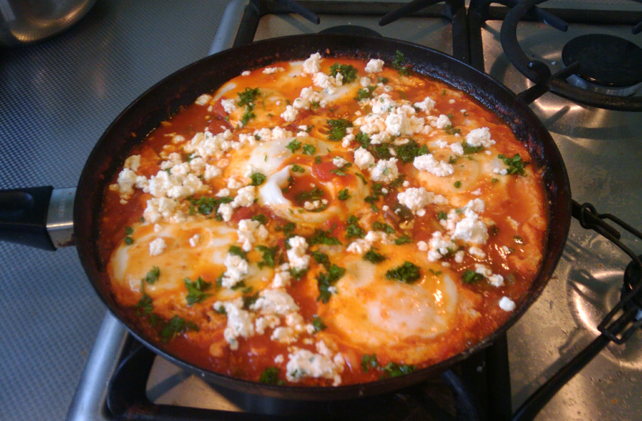 Shakshuka: Eggs Poached in Tomato Sauce (image credits: wikimedia)