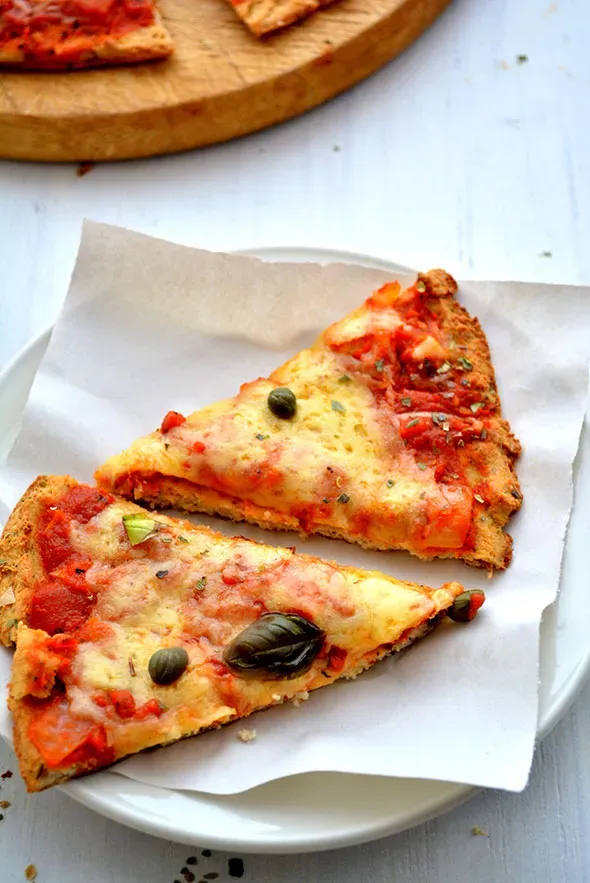 2. Pizza: America's Undisputed Comfort Champion (cauliflower crust pizza slices, CC BY-SA 2.0)