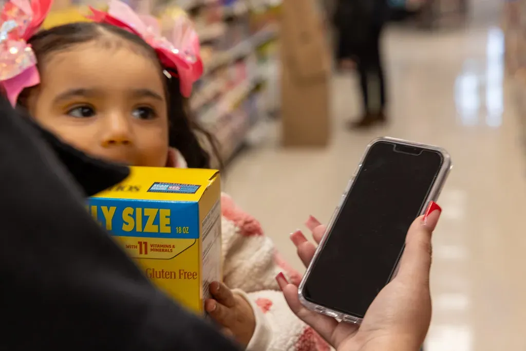 4. Blocking the Aisle While Staring at Your Phone (Image Credits: Flickr)