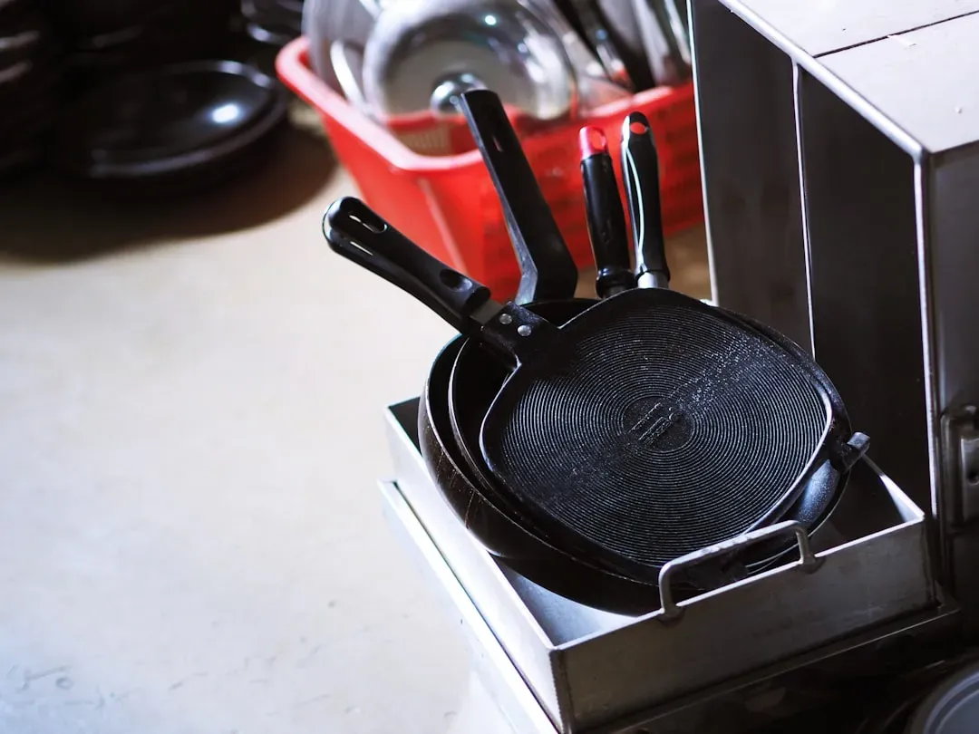 9. Stacking Pans Without Protection Between Them (Image Credits: Unsplash)