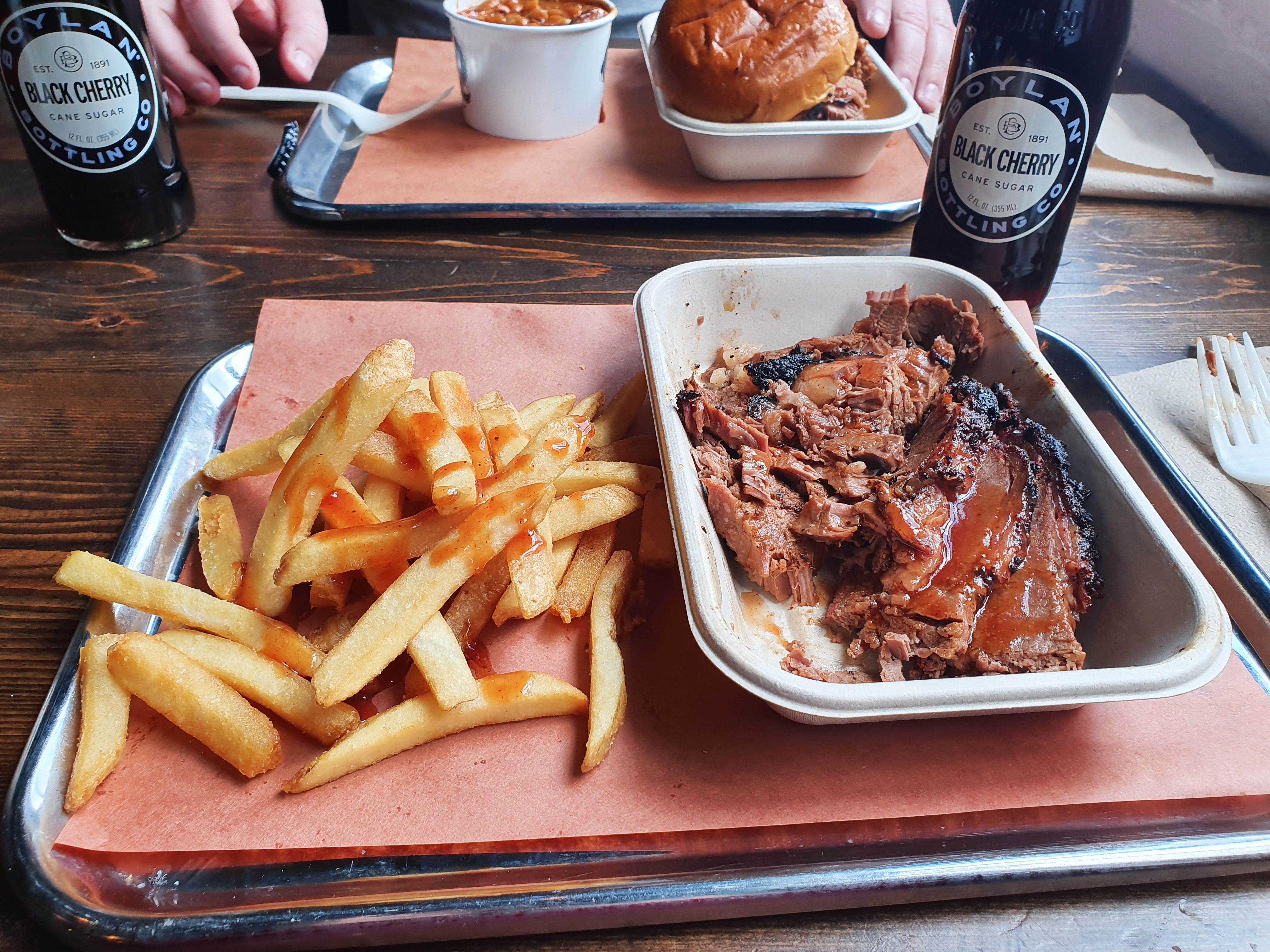 Mighty Quinn's: The East Coast's Biggest Hidden Barbecue Gem (image credits: Mighty Quinns brisket (phone), CC BY-SA 2.0, https://commons.wikimedia.org/w/index.php?curid=111020212)