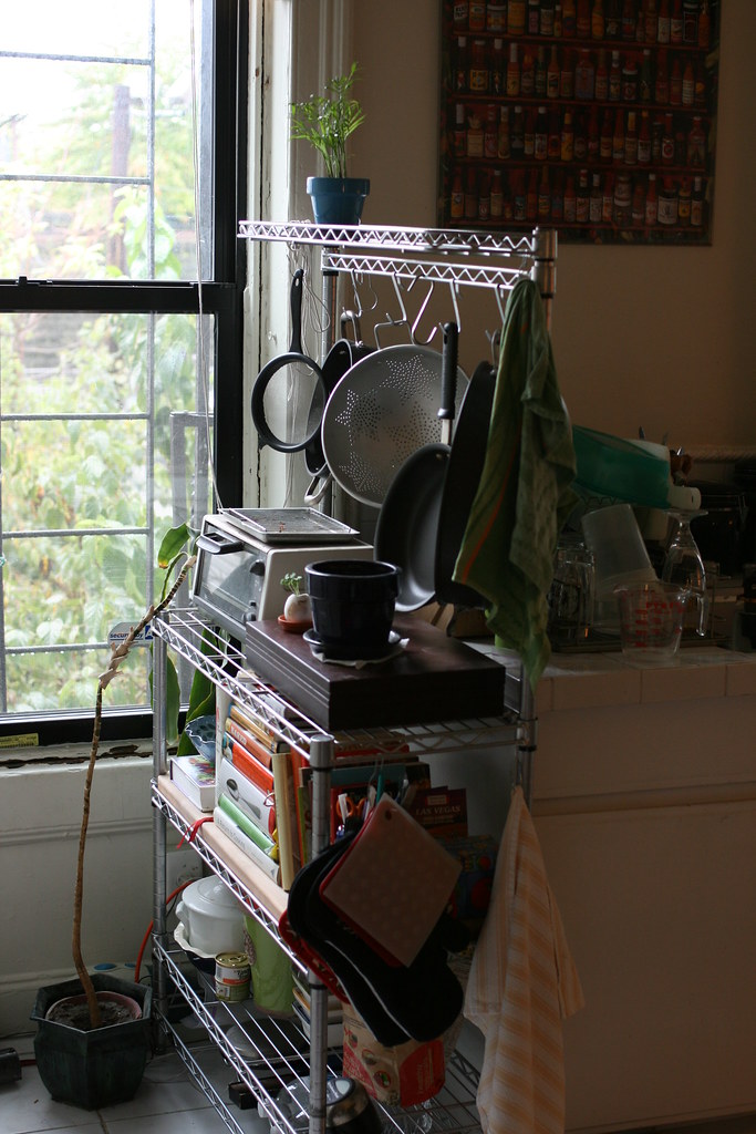Use a Tension Rod Under the Sink to Hang Spray Bottles (image credits: flickr)