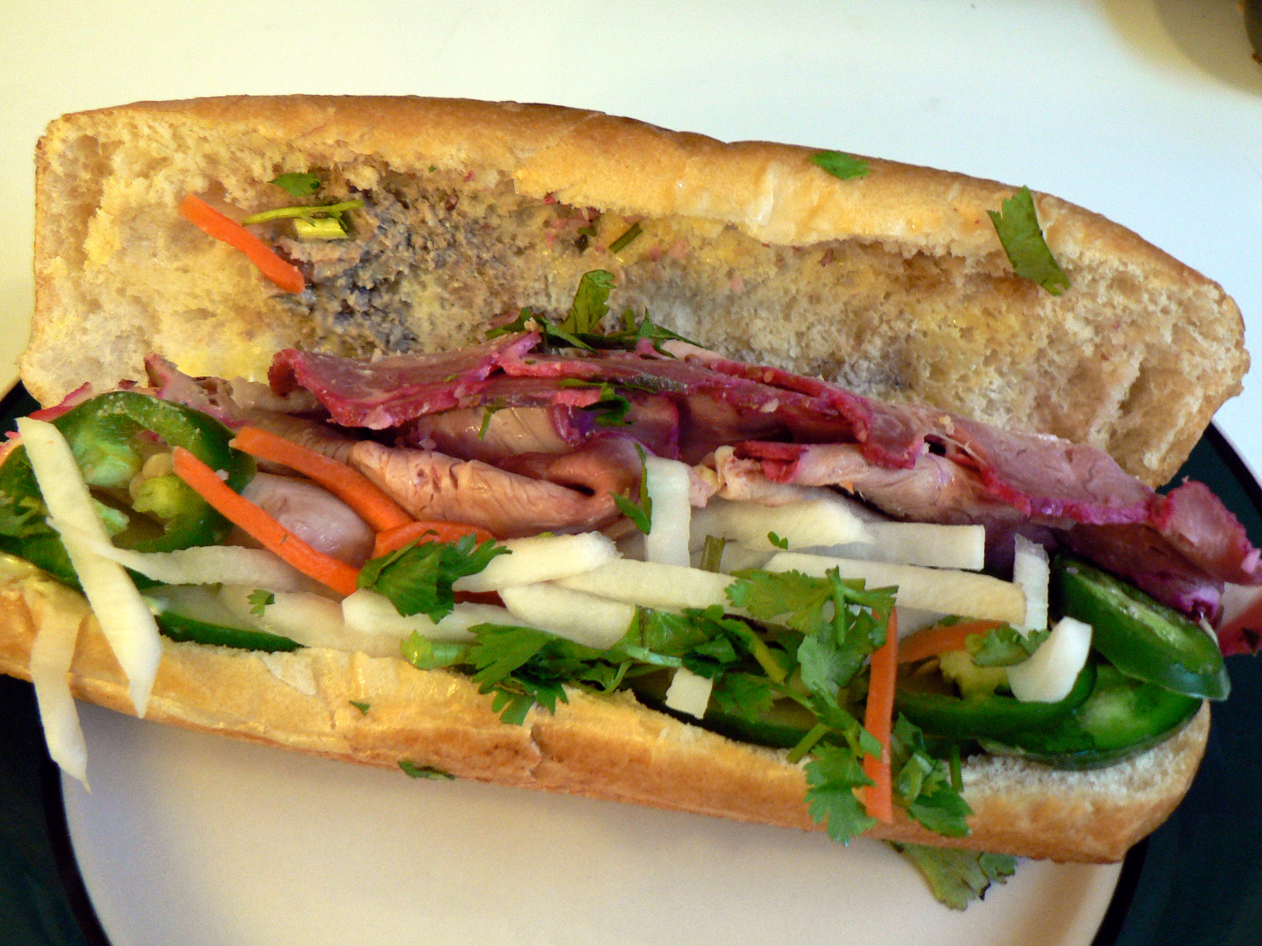 Banh Mi from Saigon's Sidewalk Vendors (image credits: By Stu Spivack, CC BY-SA 2.0, https://commons.wikimedia.org/w/index.php?curid=858975)