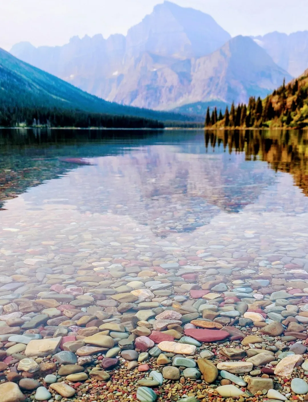 #5 - Lake McDonald, Montana: Rainbow Rocks Under Glass (Image Credits: Unsplash)