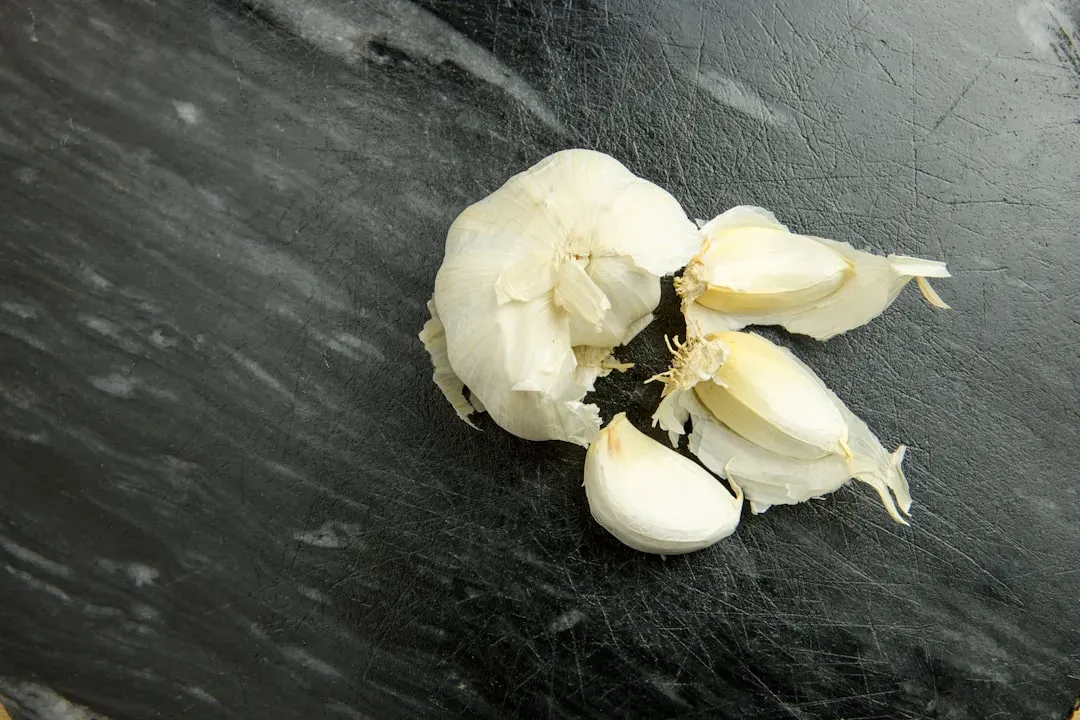7. Garlic: The Kitchen Staple That Pulls Double Duty (Image Credits: Unsplash)