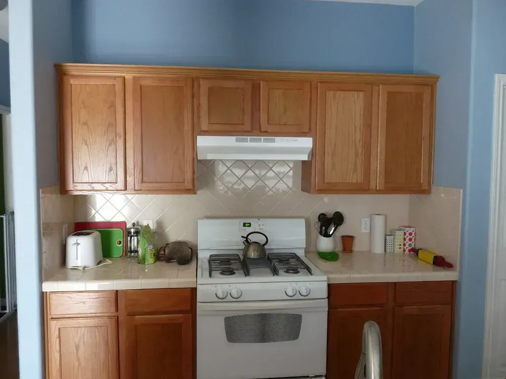 6. Dark Wood Cabinetry (Image Credits: Flickr)