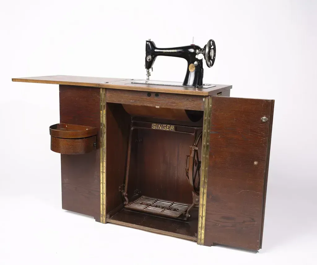 Sewing Machines with Treadle Tables: Stitched Together with History (Image Credits: Flickr)