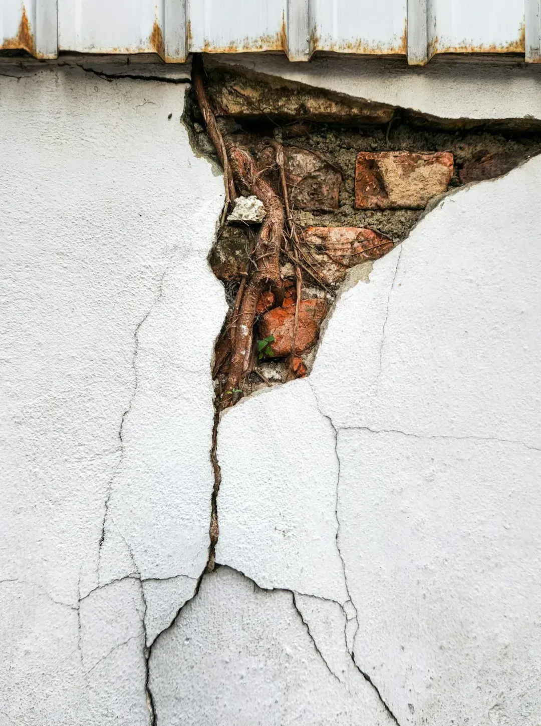 Sign #5: Cracks Radiating Around Door Frames and Windows Inside (Image Credits: Unsplash)