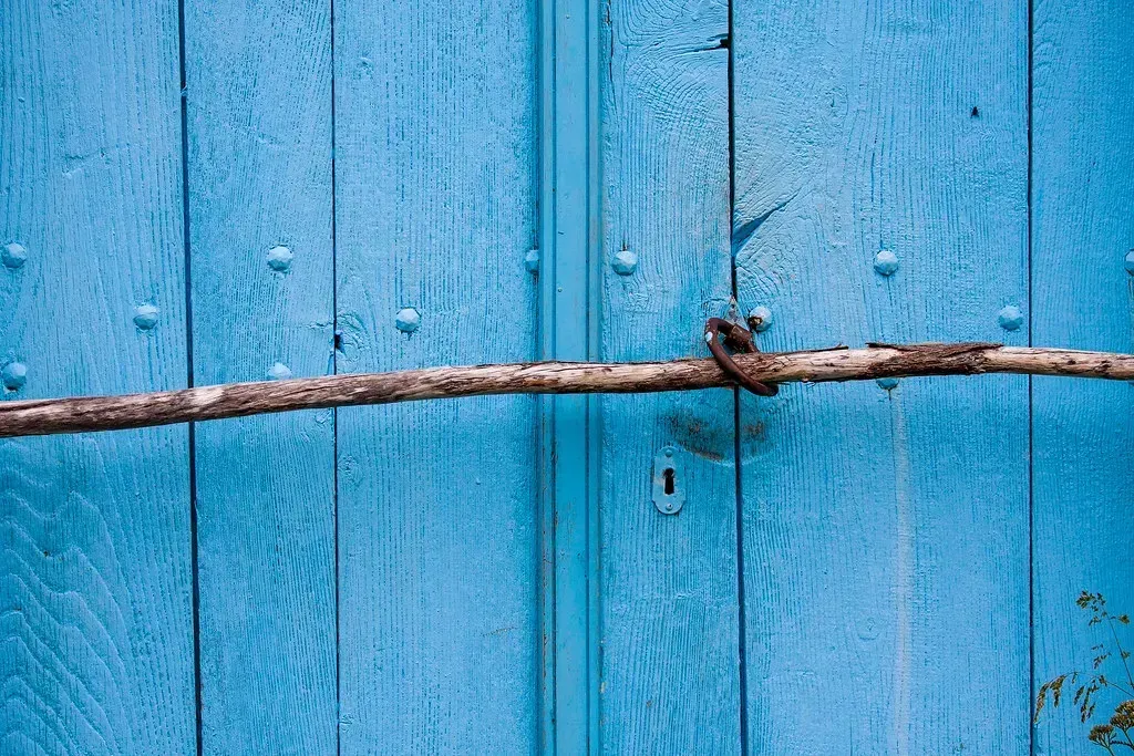 Sign #3: Doors and Windows That Stick or Won't Latch (Image Credits: Flickr)