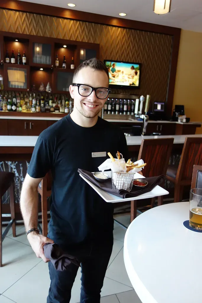 7. Interrupting the Server While They Are at Another Table (Alan Light, Flickr, CC BY 2.0)