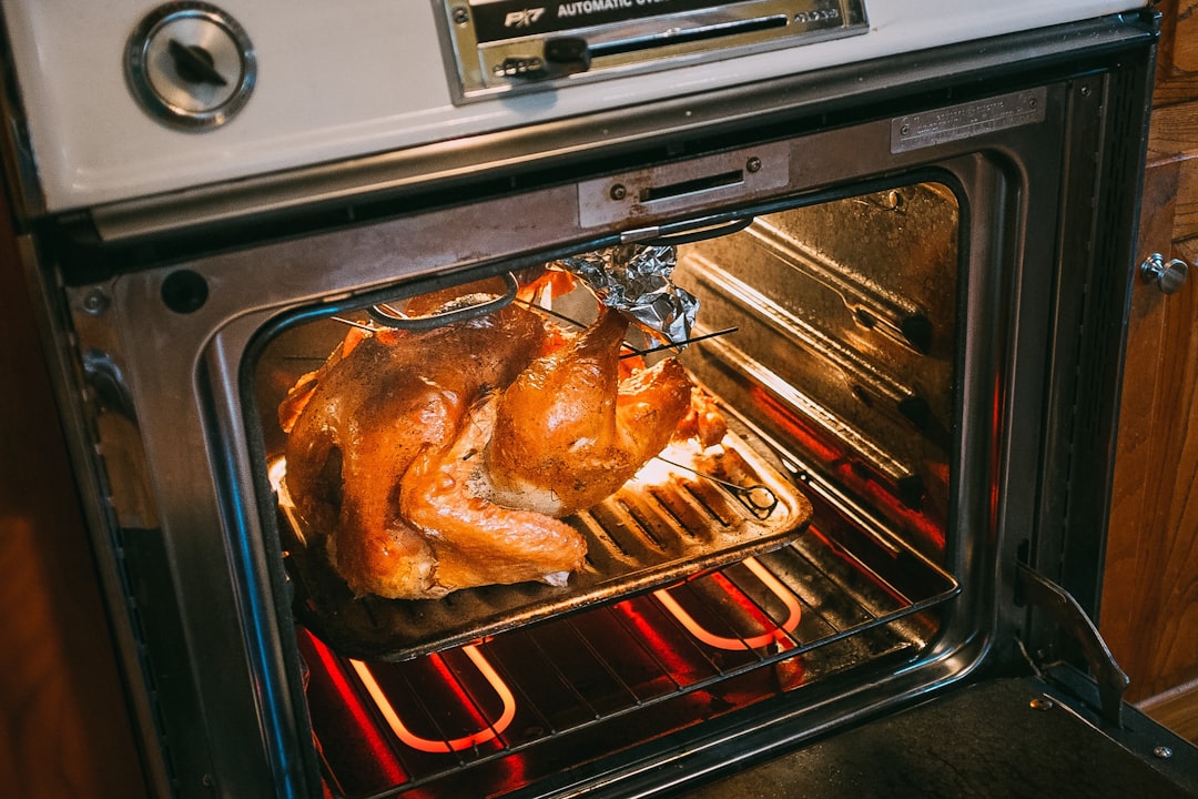 Constantly Opening the Oven Door (Image Credits: Unsplash)