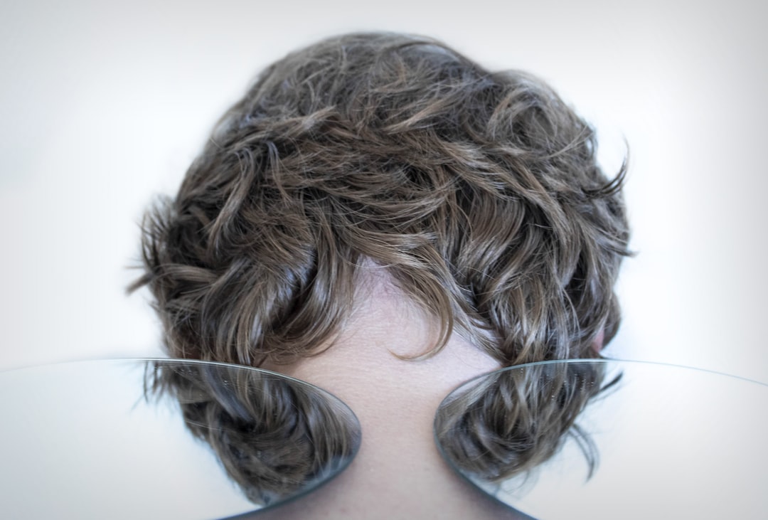 Wispy Bangs for Subtle Face Narrowing (image credits: unsplash)