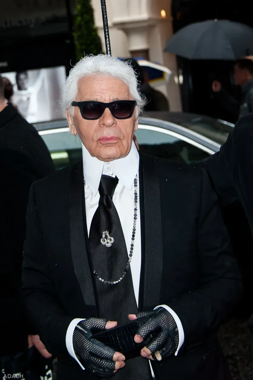 2. Karl Lagerfeld Left His Fortune to His Pampered Cat Choupette (Fendi store opening - Karl Lagerfeld, CC BY-SA 2.0)