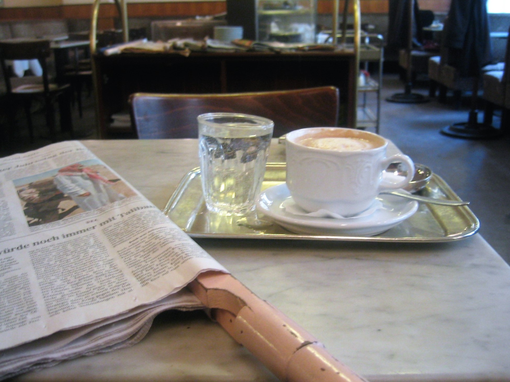 The Newspaper Ritual and Extended Presence (Image Credits: Wikimedia)