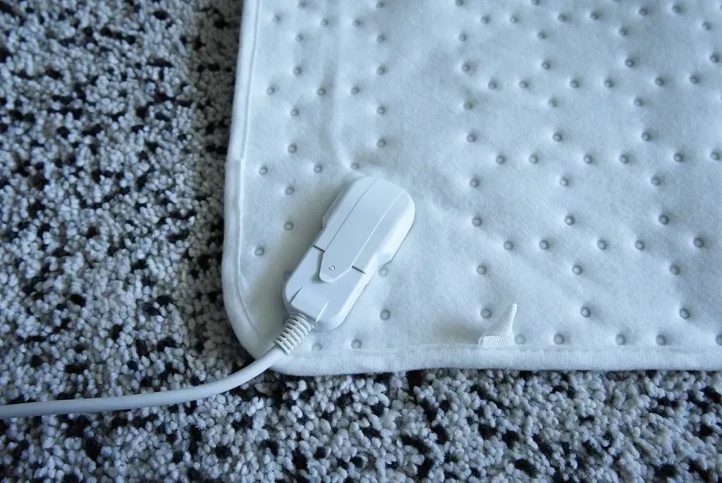 2. Electric Blankets and Heating Pads (Image Credits: Flickr)