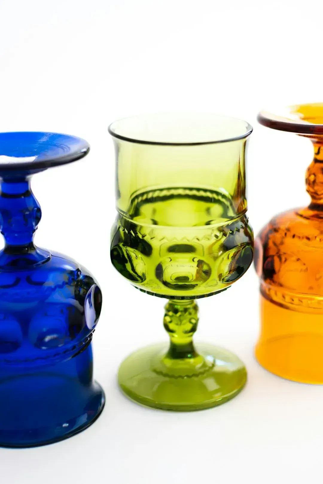 2. Vintage Colored Glassware as Display Art (Image Credits: Unsplash)