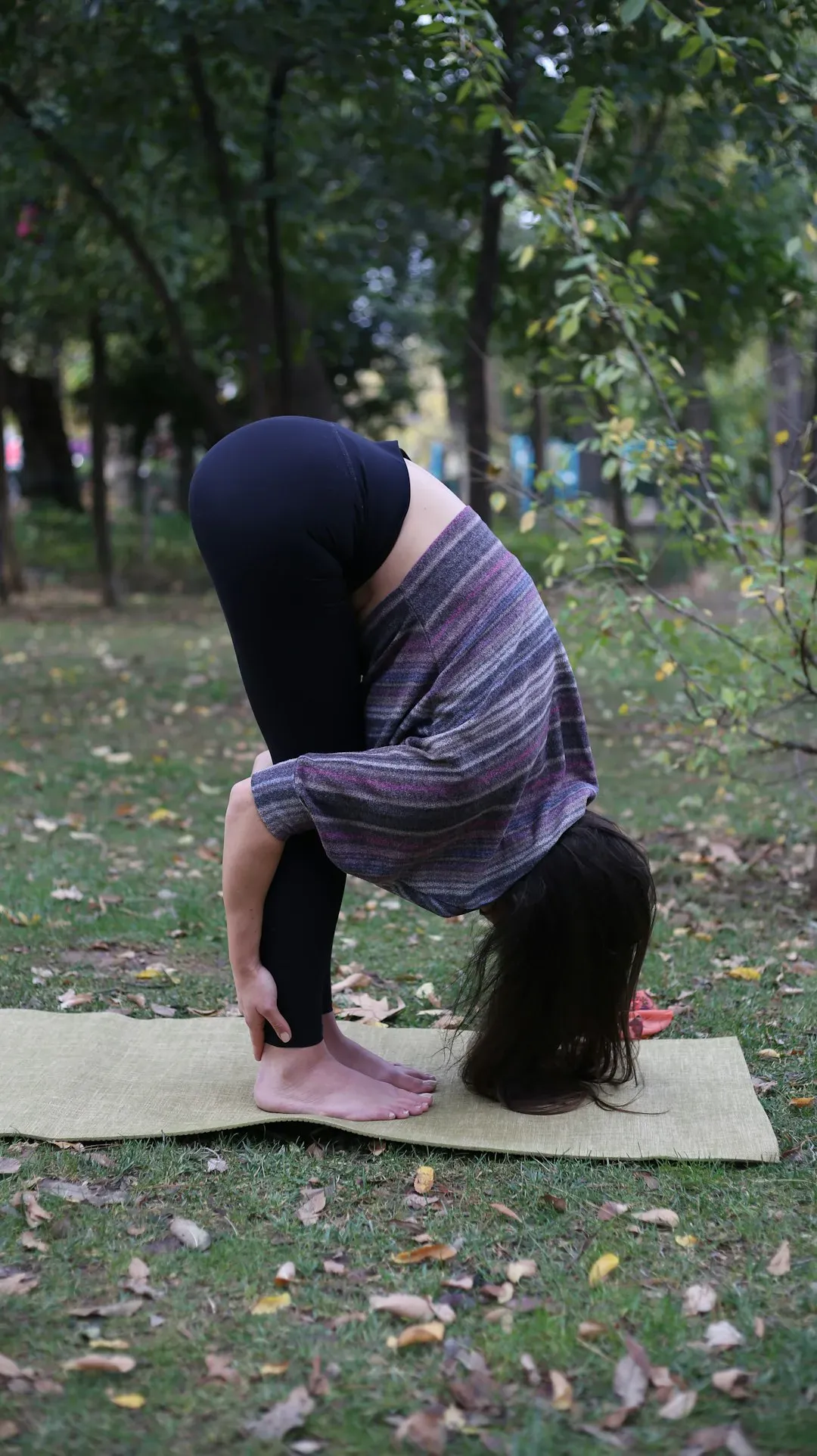 8. Standing Forward Fold (Image Credits: Unsplash)