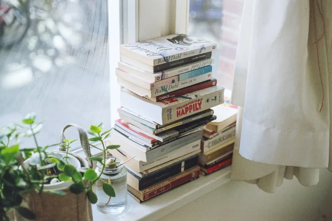 Stacks of Magazines and Unread Books (Image Credits: Unsplash)