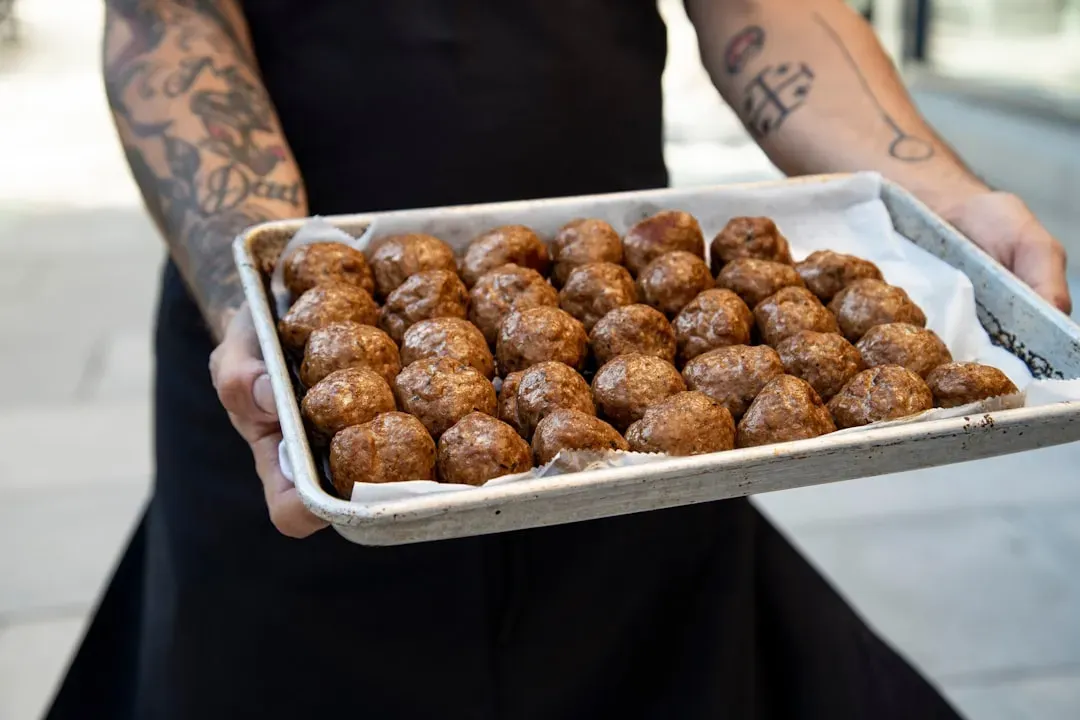 Sheet pan meatballs with marinara and mozzarella (Image Credits: Unsplash)