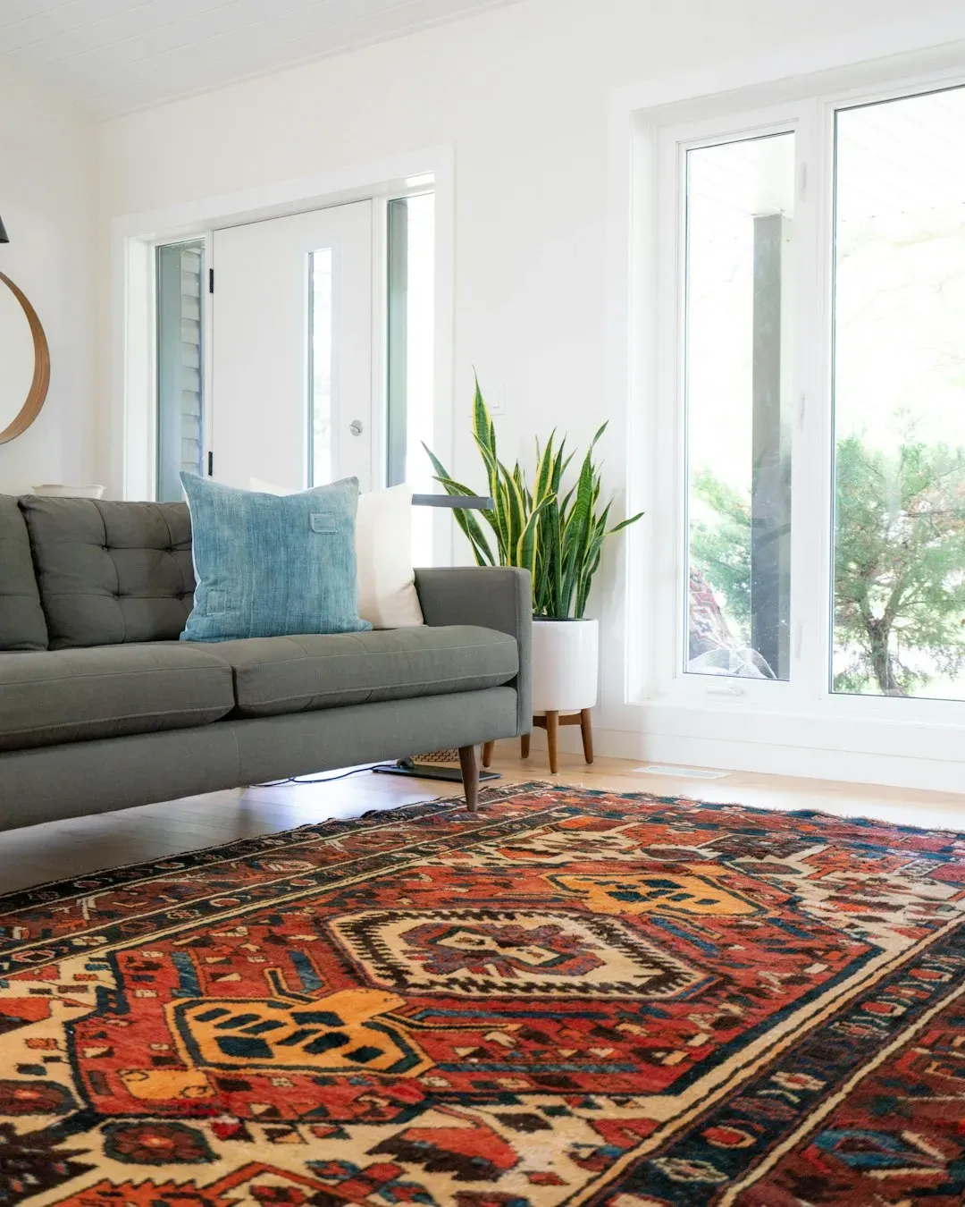 2. Grounding a room with a large area rug (Image Credits: Unsplash)