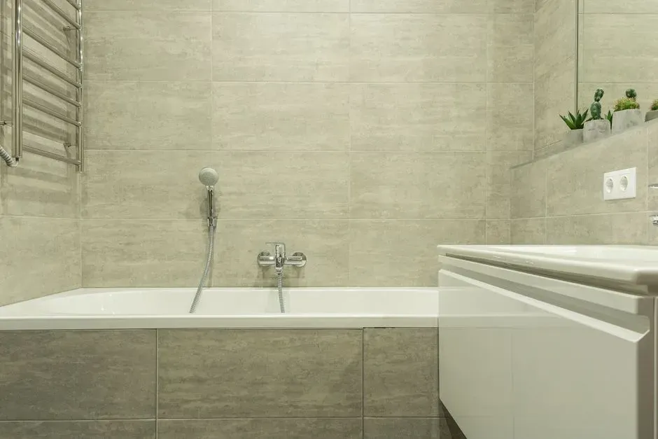 Regrout and recaulk before you touch anything else (Image Credits: Pexels)