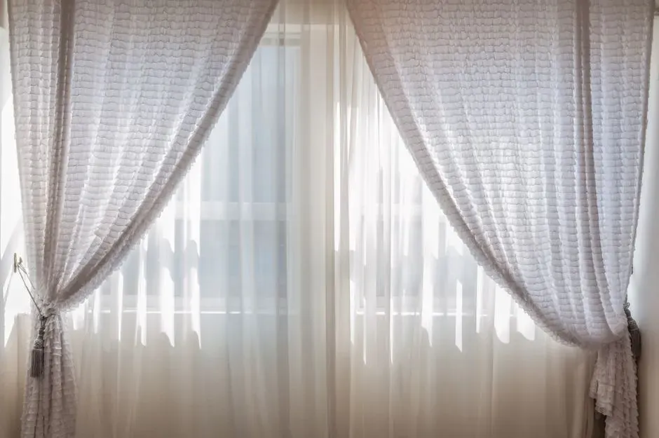 1. Swap heavy curtains for sheer or light-colored window treatments (Image Credits: Pexels)