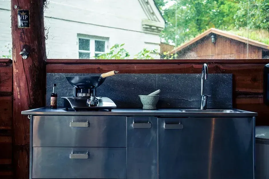 Outdoor kitchens that keep the cooking and the company together (Image Credits: Pexels)