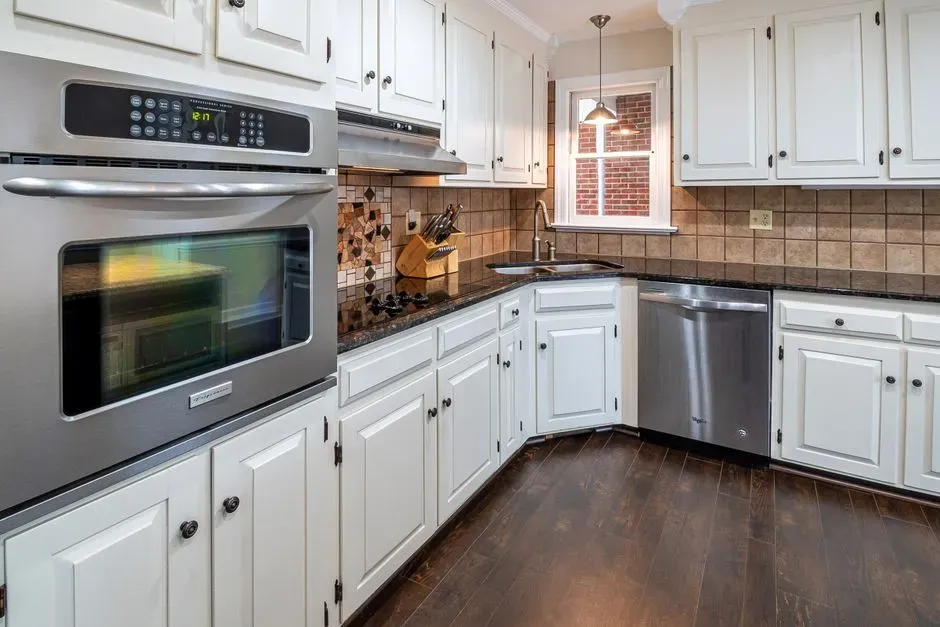 4. Refresh kitchen cabinets with new hardware and paint (Image Credits: Pexels)