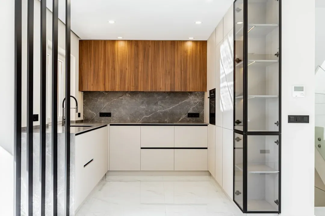 Glass-front cabinets for visible order (Image Credits: Unsplash)