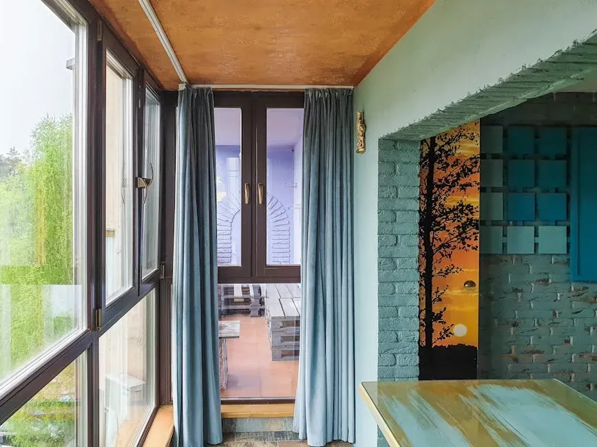 11. Ceiling-Height Curtains and Considered Window Treatments (Image Credits: Pexels)