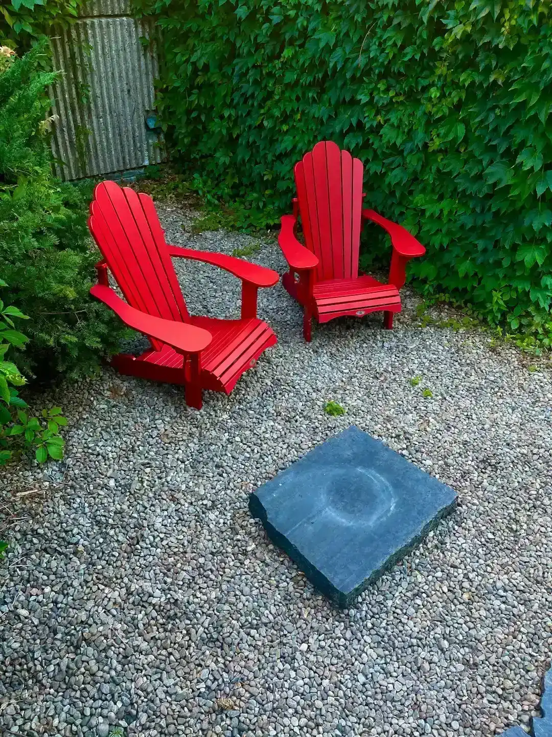 A gravel patio with two good chairs (Image Credits: Unsplash)