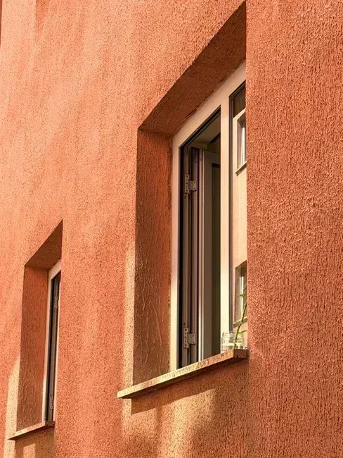 7. Thick masonry walls for thermal mass (Image Credits: Pexels)