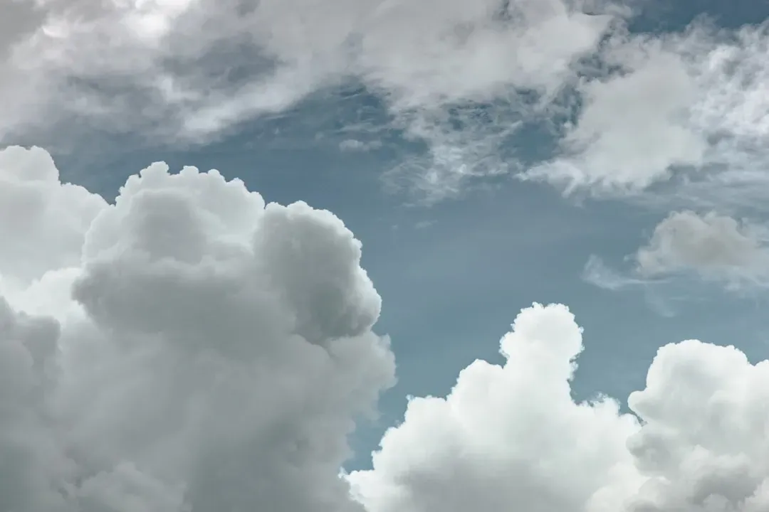 2. Towering cumulus clouds stacking vertically (Image Credits: Unsplash)