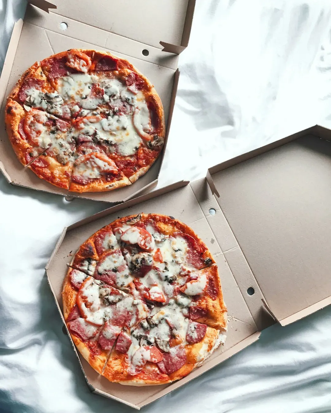 4. Greasy Pizza Boxes (Image Credits: Unsplash)