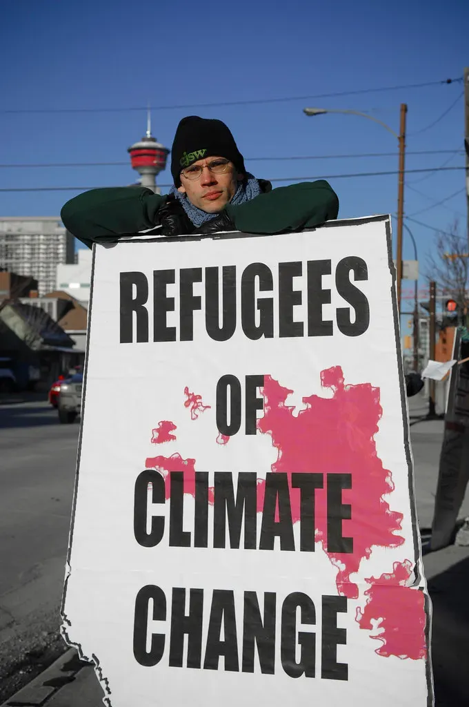 9. Socioeconomic Vulnerability Determines Who Can Flee and Who Gets Left Behind (Visible Hand, Flickr, CC BY 2.0)