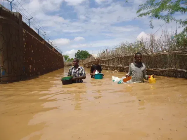7. East and Central Africa: Kenya, Tanzania, and Botswana (Wading through flood waters, CC BY 2.0)