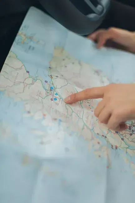 16. Paper map and printed emergency contacts (Image Credits: Pexels)