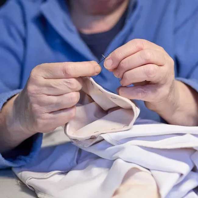 2. Mending clothes instead of replacing them (Image Credits: Pexels)