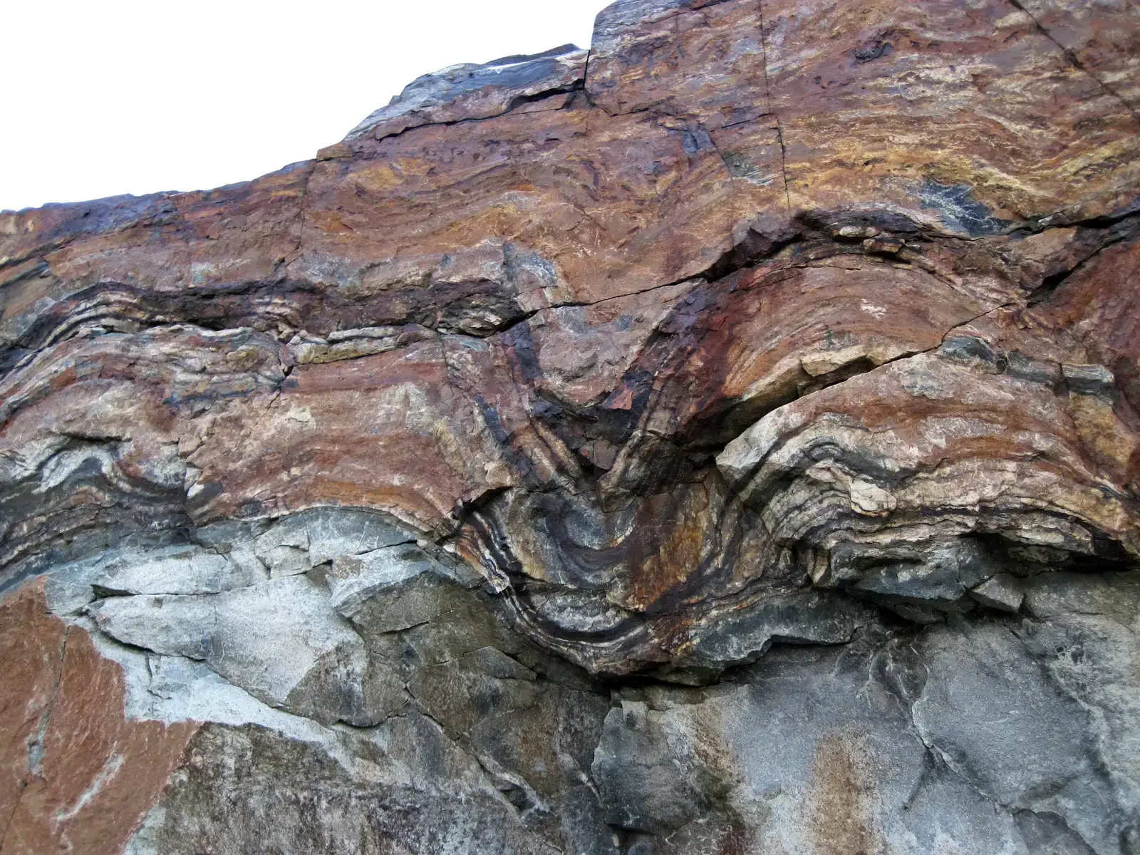 4. The Rusted Planet: When Oceans Turned the World Red (Banded iron-formation over basement rocks (Archean; Route 17 roadcut east of Bridget Lake, south of Wawa, Ontario, Canada) 14, CC BY 2.0)