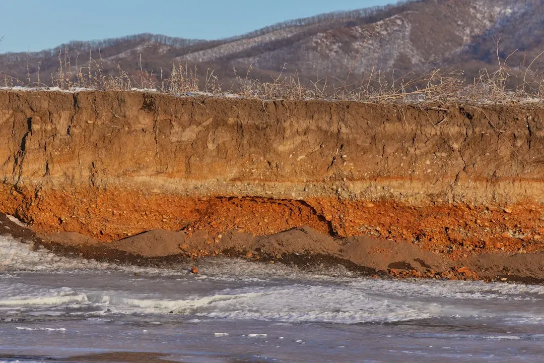 #12 Tsunami and Superstorm Layers Hidden in Coastal Cliffs (Image Credits: Unsplash)