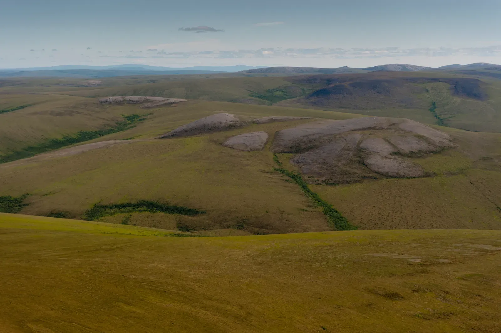 #3 - A Landscape of Rolling Hills, Hidden Valleys, and Quiet Lagoons (Rolling hillsUploaded by AlbertHerring, Public domain)