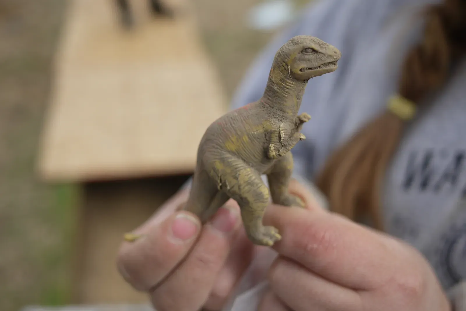 Nostalgia, Childhood Wonder, and the Dinosaur Imprint (Excavated toy dinosaur, Patterson Park, CC BY-SA 2.0)